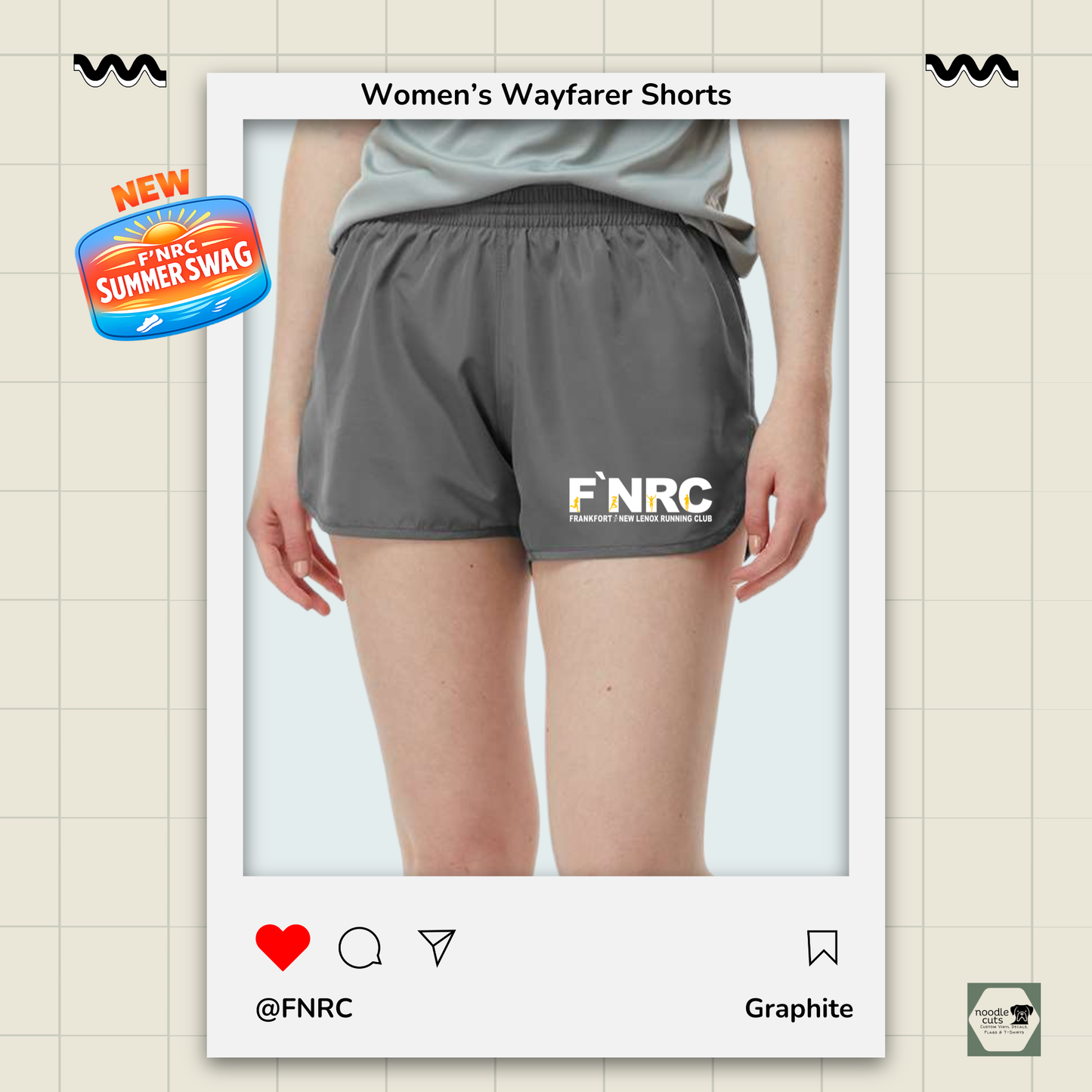 Close up view of graphite Augusta Women's Wayfarer running shorts featuring the FNRC Signature Logo in white and gold.