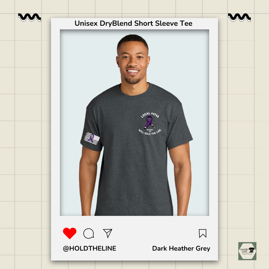 Man wearing a dark Heather Grey t-shirt with logos on a light beige background